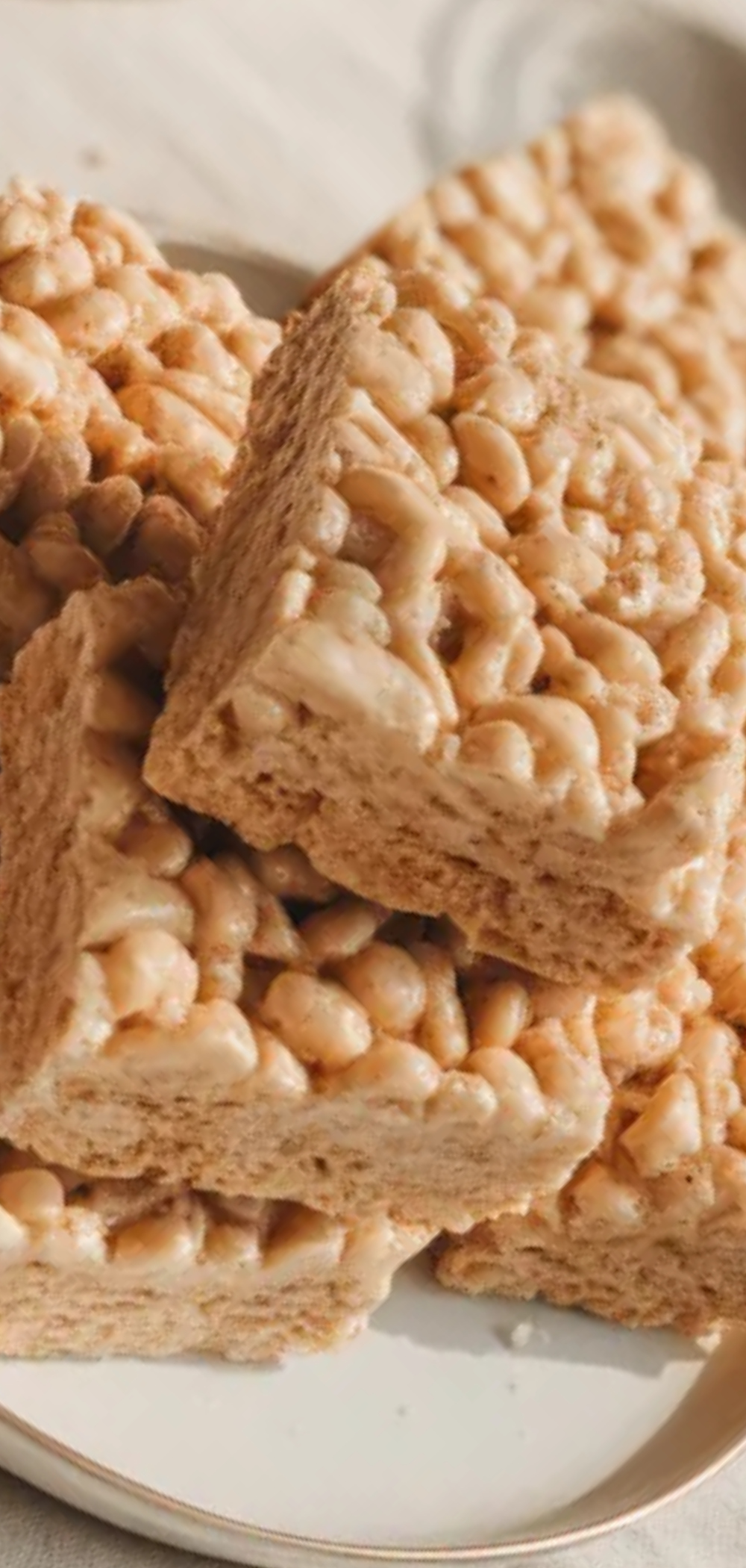 Simple no bake brown butter Rice Krispies treats served on a white plate with a clean food blog aesthetic