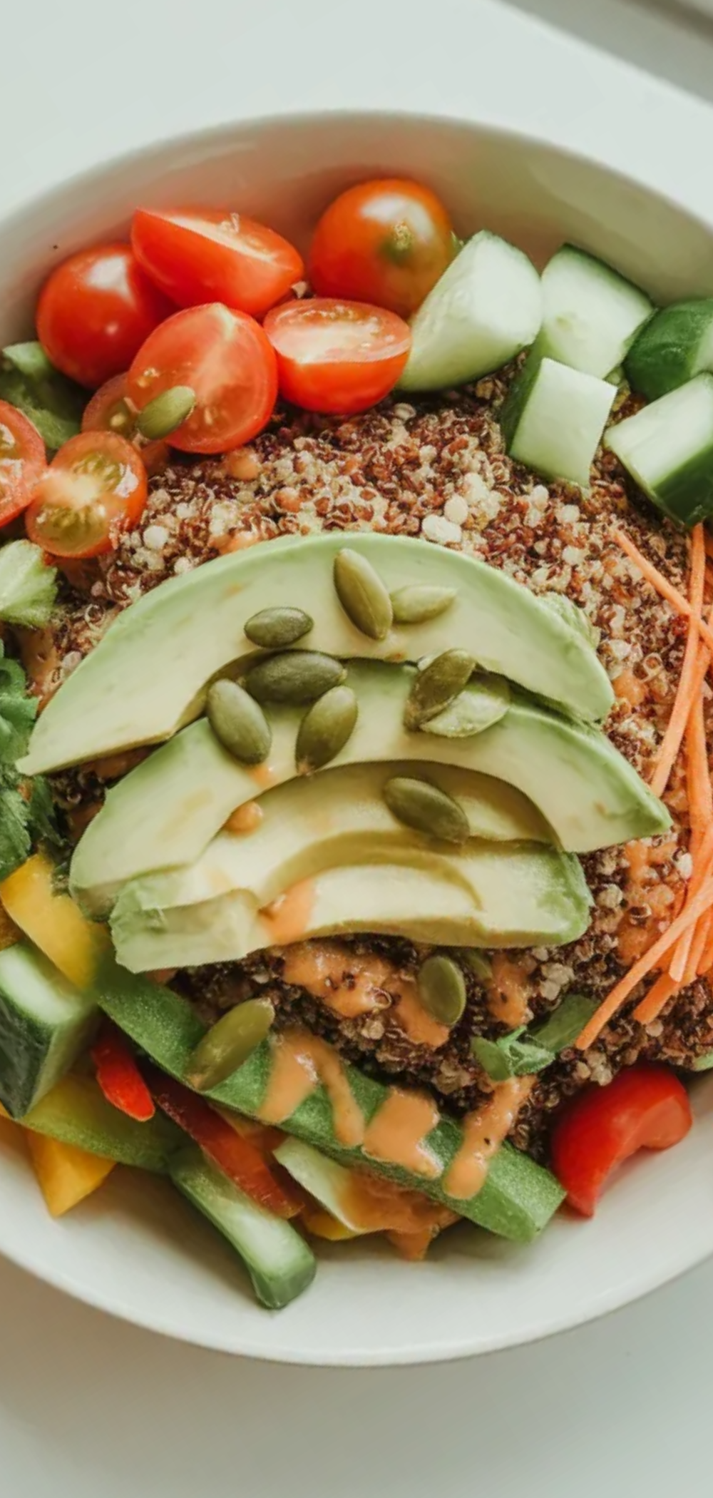 “Vibrant and nutritious quinoa and veggie bowl with feta, avocado slices, and roasted chickpeas, bright white background, perfect for meal prep”