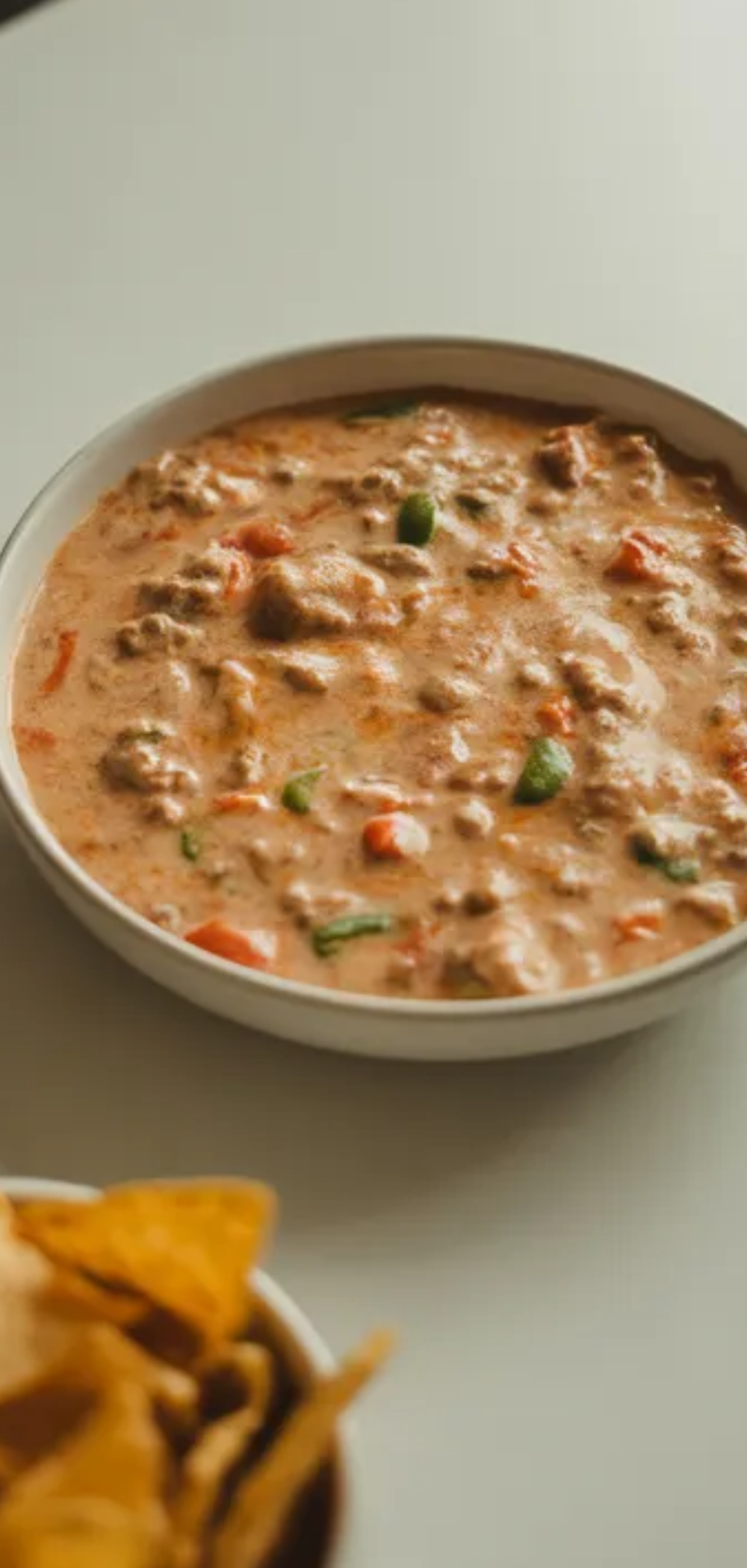 Easy cheesy Rotel dip with ground beef and tomatoes perfect for parties and snacks